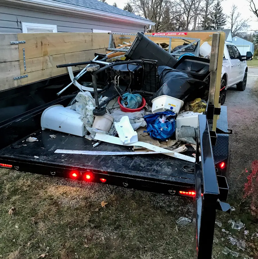 Roll-off dumpster delivered to a residential driveway in Manchester
