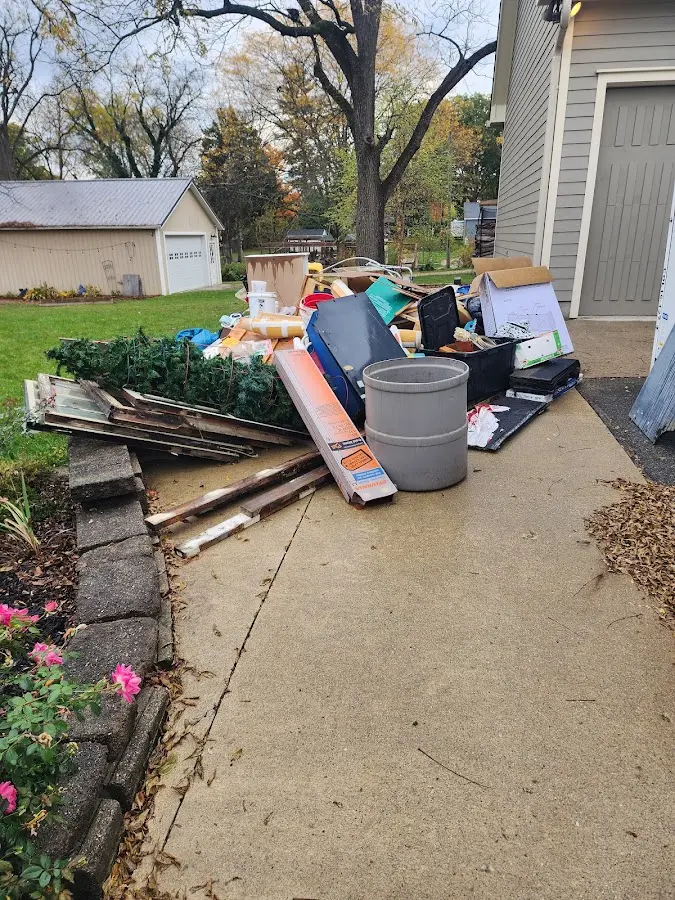 Dumpster being loaded with debris for Commercial Dumpster Rental in Manchester